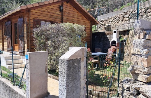 Poggiolo Ski Chalet | Chalet garden between hiking maquis swimming
