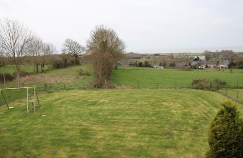Dragey-Ronthon Cottage | Contemporary house with enclosed garden, terrace and bay views