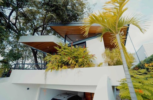 Playa Langosta House | Discover the essence of tropical living at Casa Las Abejas, a stylish villa with a private pool, spacious design, and lush surroundings.