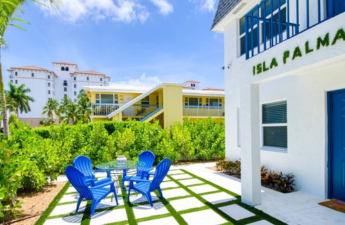 Palm Beach Shores Condo | Dog-friendly gem with furnished patio, hot tub, grill, fast WiFi & central AC