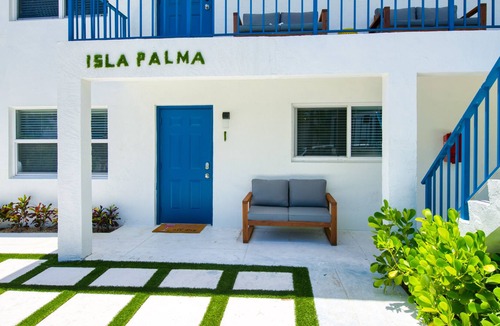 Palm Beach Shores Condo | Dog-friendly gem with furnished patio, hot tub, grill, fast WiFi & central AC