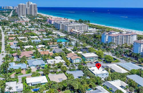 Palm Beach Shores Condo | Dog-friendly gem with furnished patio, hot tub, grill, fast WiFi & central AC