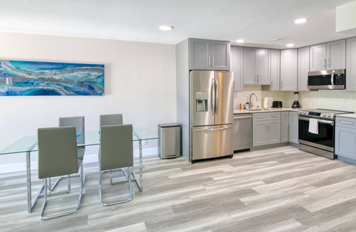 Palm Beach Shores Condo | Dog-friendly gem with furnished patio, hot tub, grill, fast WiFi & central AC