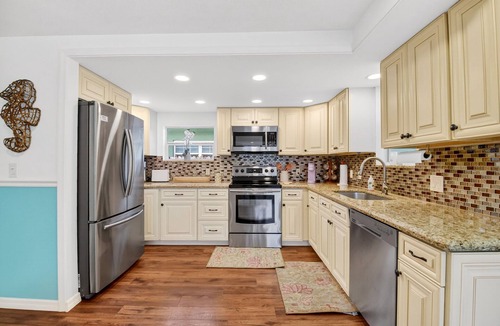 Parrot Cove House | Palm Beach Pool Oasis Walk to Golf, Beach, and the Ave