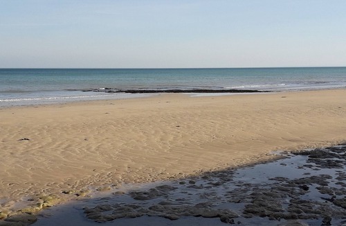 Langrune-sur-Mer Apartment | Waterfront apartment with your feet in the water!