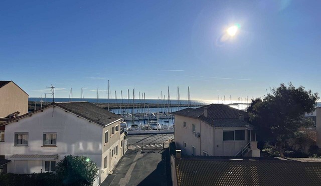 Comfortable 1BR with A/C, balcony, secure parking, near beach and shops